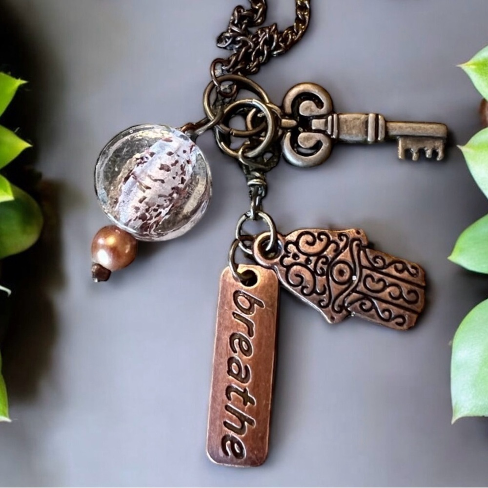 Unique bronze necklace key and charm details clear glass bead and 'breathe' tag. - Picture 15 of 15